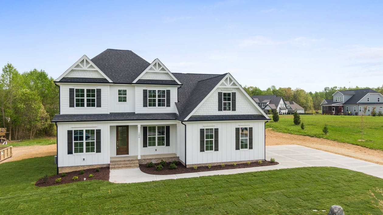two-story home white siding