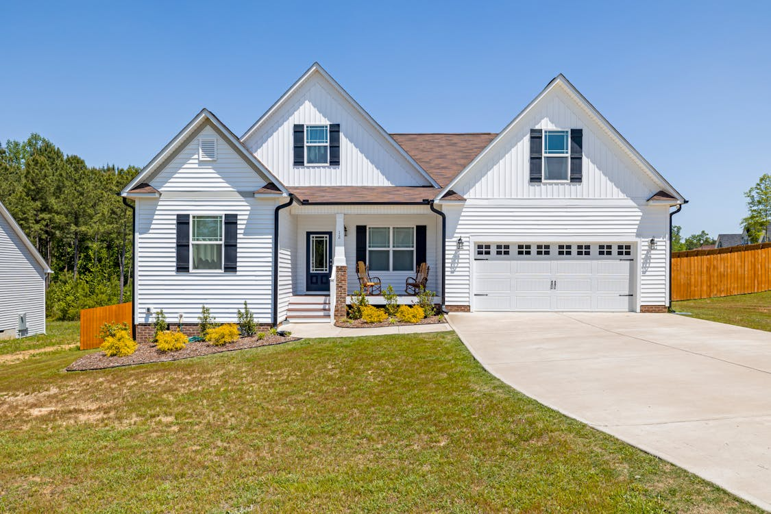 two-story family home has white siding