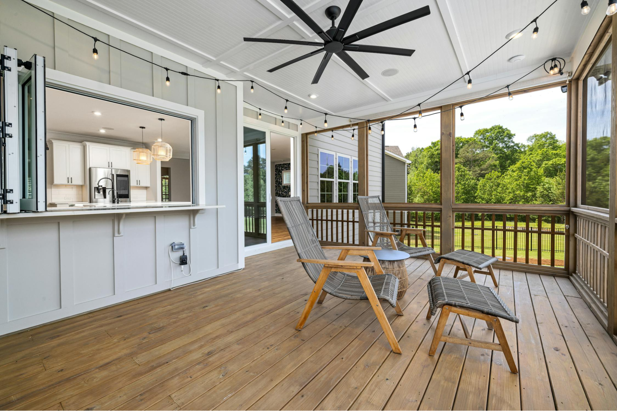 This image depicts a patio area with black string lights to add ambiance to the space.