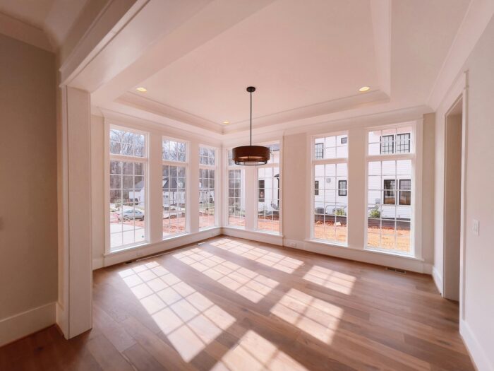 This addition adds a sunroom off the side of the home for another area for entertaining and relaxing.