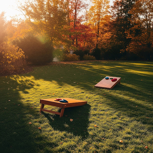 A backyard features two cornhole boards ready to be used for a fall hangout.