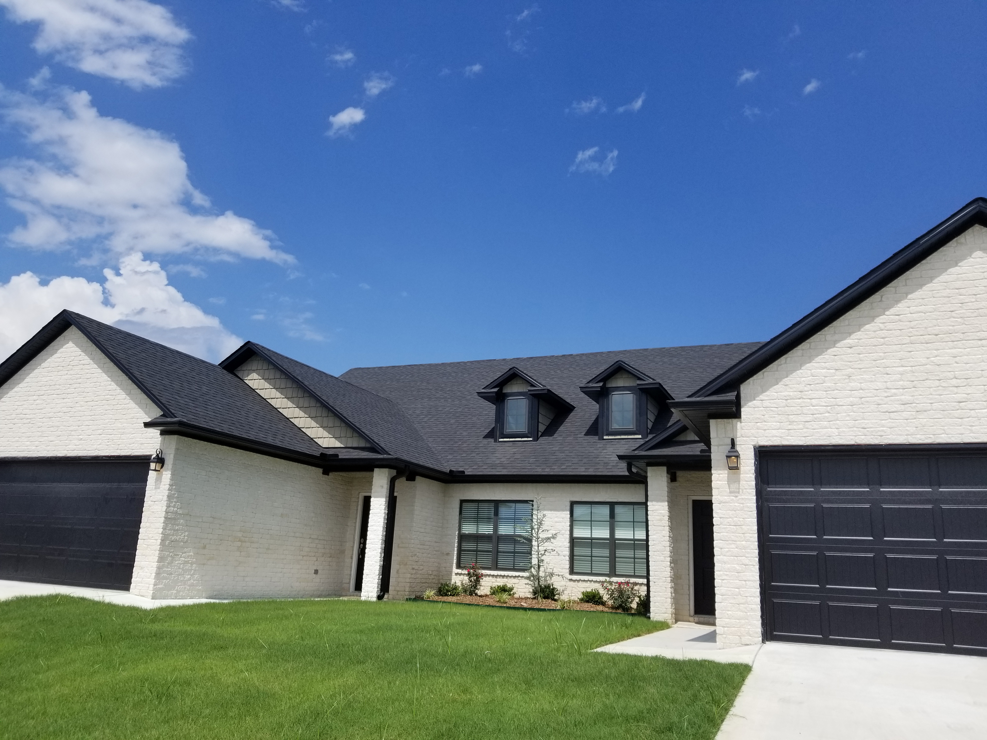 Black Soffit With White Brick