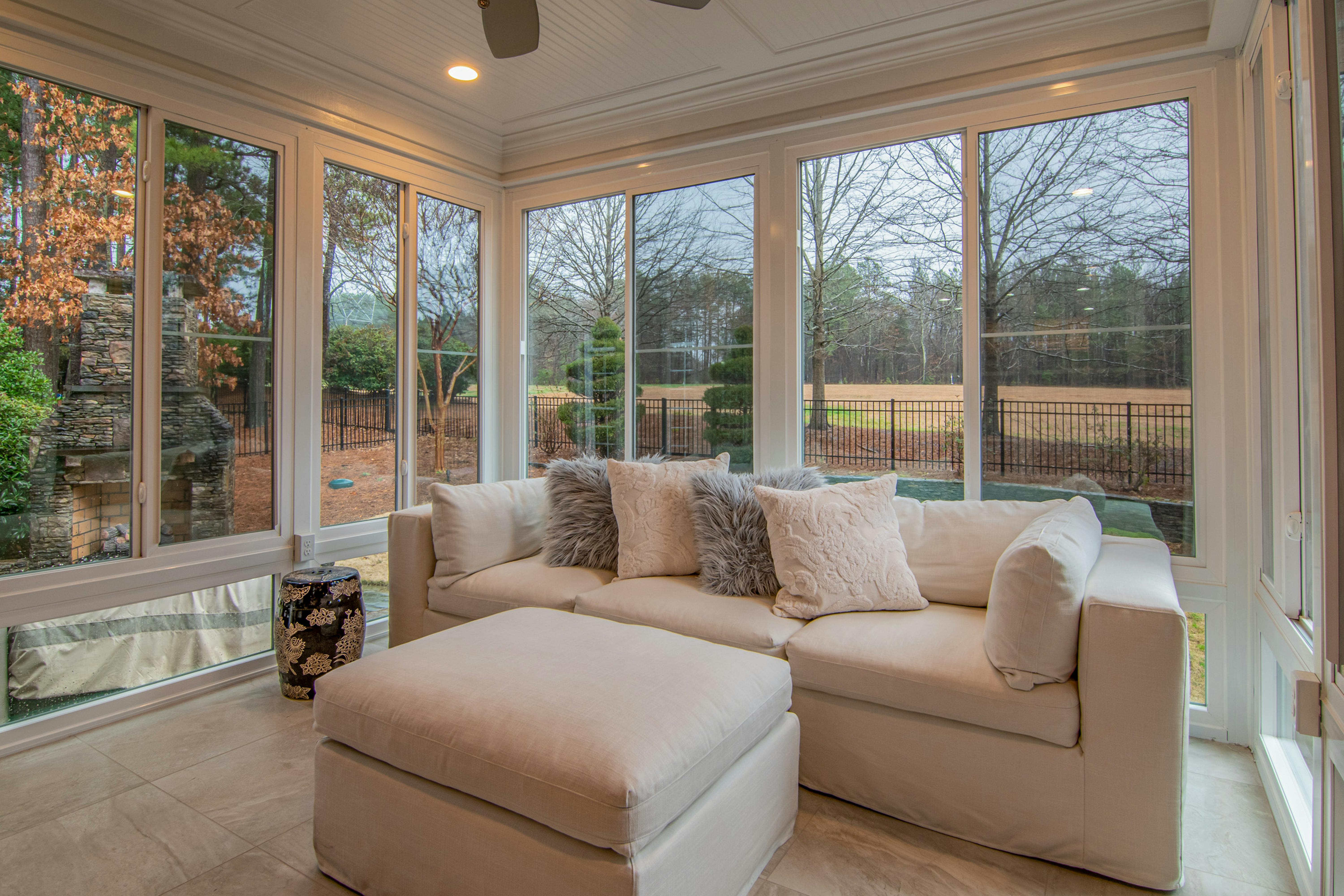 This sunroom addition has a comfy sofa to create another lounge area in the home.