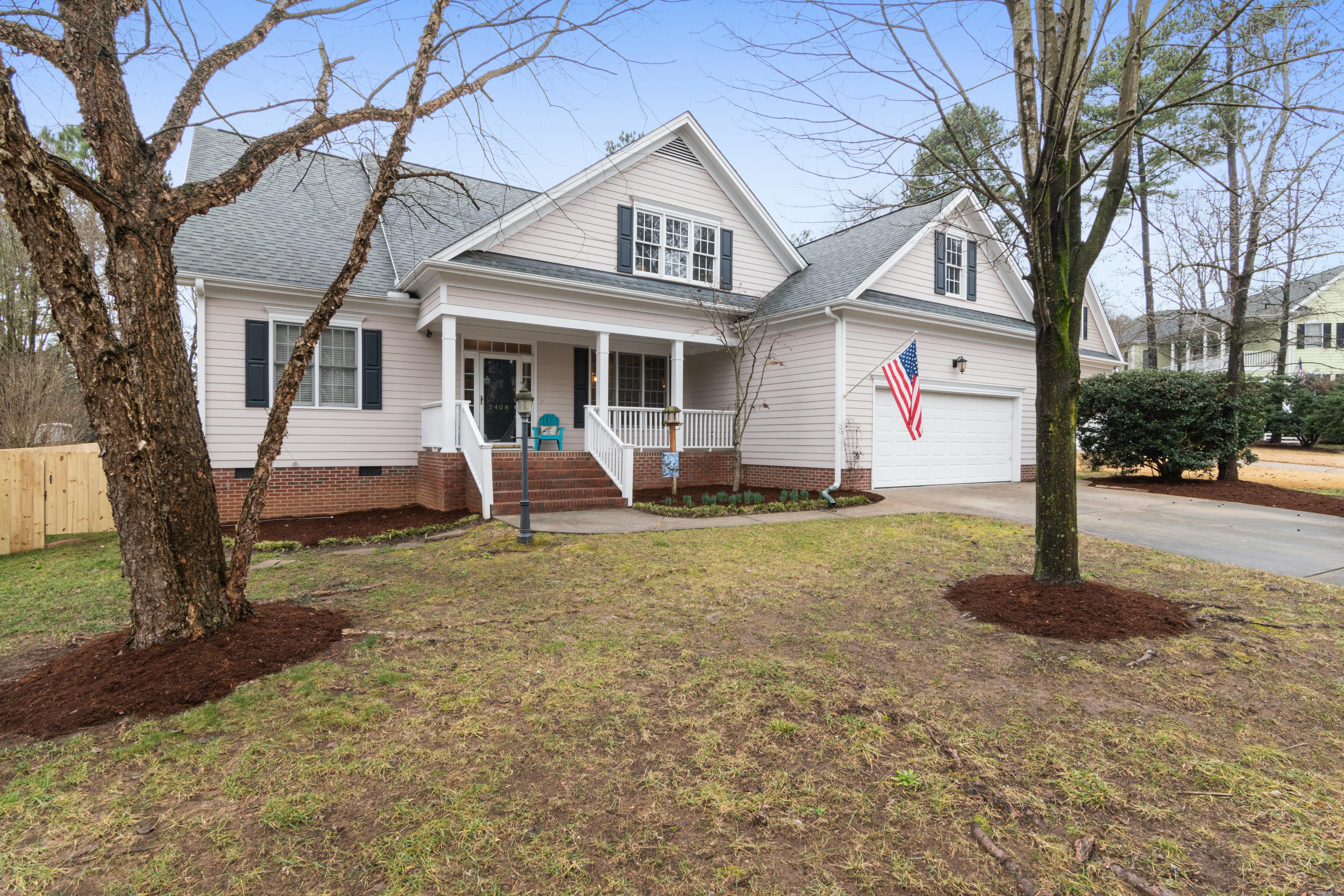 This image depicts a traditional home with cream clapboard siding.