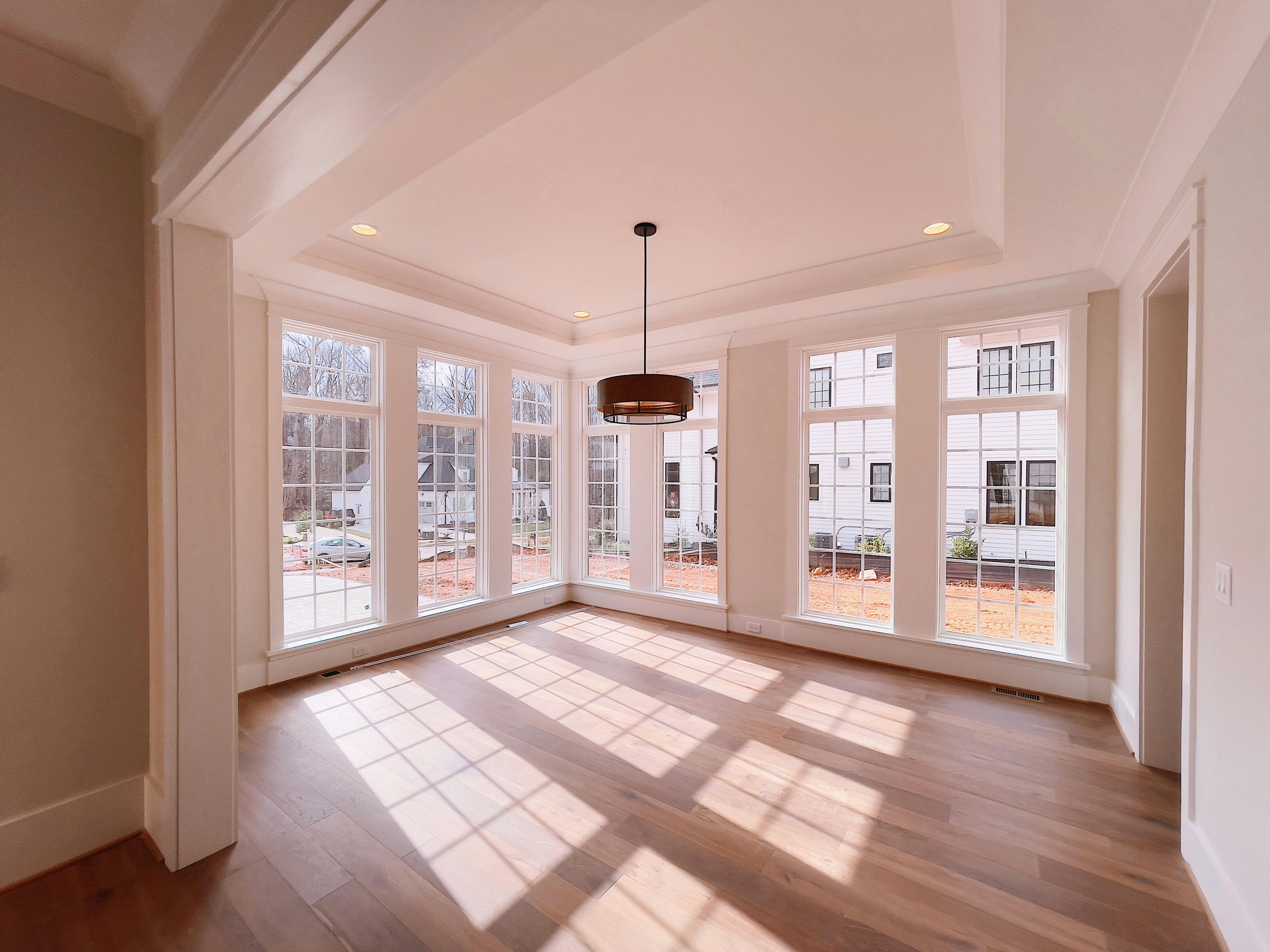 This addition adds a sunroom off the side of the home for another area for entertaining and relaxing.